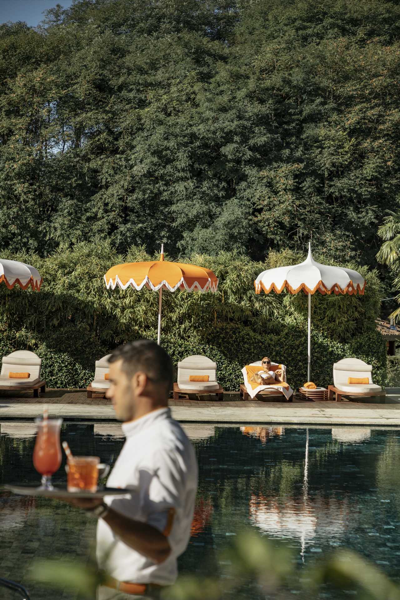 5 Waiter Passing By The Flowers Pool